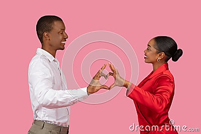 African american couple in love making heart shape with hands Stock Photo