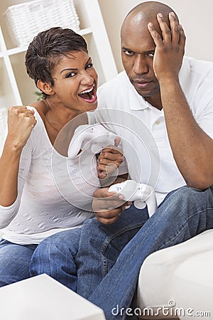 African American Couple Playing Video Console Game Stock Photo