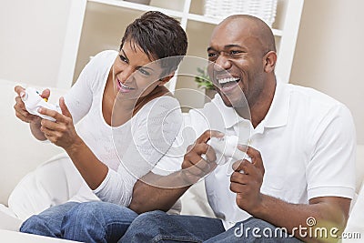 African American Couple Playing Video Console Game Stock Photo