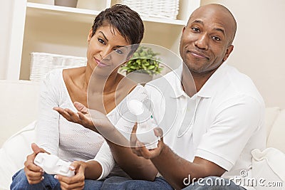 African American Couple Playing Video Console Game Stock Photo