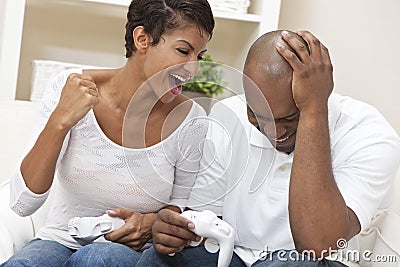 African American Couple Playing Video Game Stock Photo