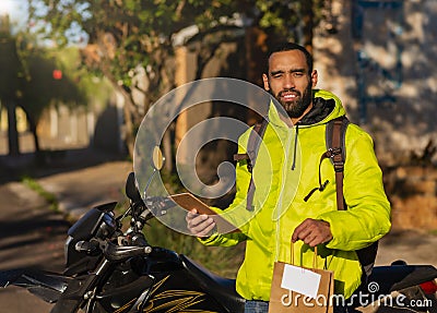 African american delivery man performing home delivery Stock Photo