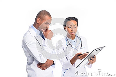 african american doctors in white coats with stethoscopes and diagnosis, Stock Photo