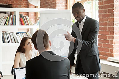 African american employee behaving rudely during briefing meetin Stock Photo