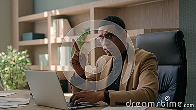 African American ethnic man serious businessman working online on laptop at office dissatisfied male investor business Stock Photo