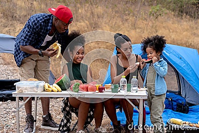 African american family eating food during picnic Stock Photo