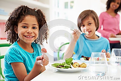 African American Family Eating Meal At Home Together Stock Photo