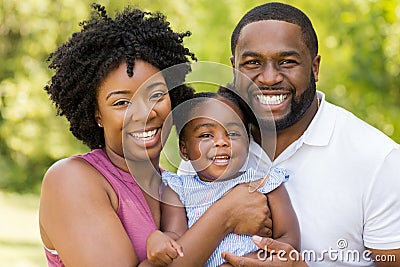 Happy African American family laughing and smiling. Stock Photo