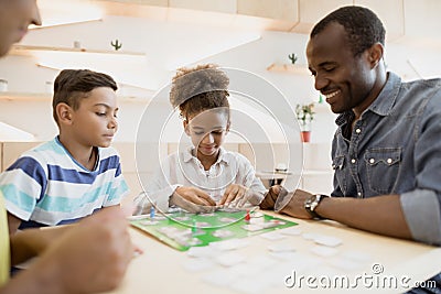 african-american family playing board game Stock Photo