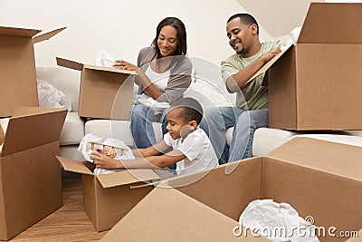 African American Family Unpacking Moving Boxes Stock Photo