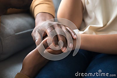 African father holding hands of child as charity support concept Stock Photo