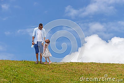 African american father and daughter with clipping path taking a walk, happy young parents walking with child, Happiness family Stock Photo