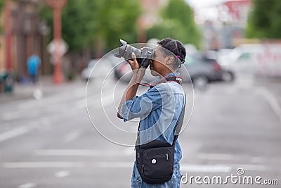 African American female photographer with Canon camera Editorial Stock Photo