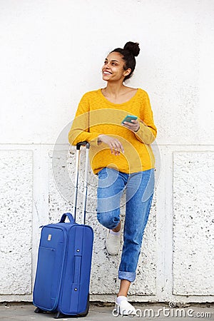 African american female traveler standing outdoors Stock Photo