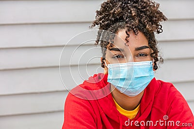 African American female young woman wearing face mask in Coronavirus COVID-19 pandemic Stock Photo