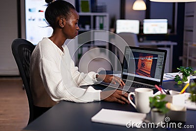 African american game developer testing new game working late at night Stock Photo