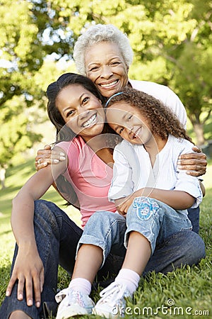 African American Grandmother, Mother And Daughter Relaxing In Pa Stock Photo