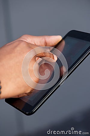 African american hand holding digital touch screen tablet Stock Photo