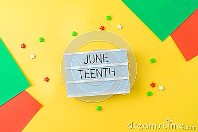 African American holiday Juneteenth background with lightbox and colorful bright paper Stock Photo