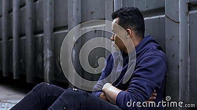 African-american homeless boy alone in hopeless situation, social problems Stock Photo