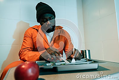 african american inmate eating Stock Photo