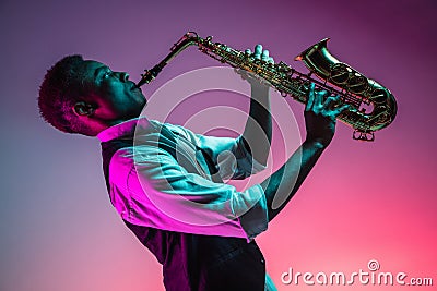 African American jazz musician playing the saxophone. Stock Photo