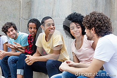 African american and latin young adults talking about politics Stock Photo