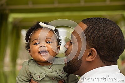 African American father holding his daughter. Stock Photo