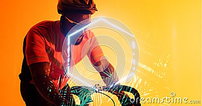 African american male athlete wearing helmet and eyewear riding bike by hexagon and plants Stock Photo