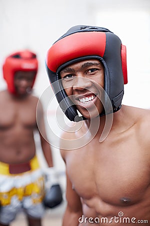 African American male boxer smiling. Portrait of African American male boxer smiling with competitor standing in Stock Photo