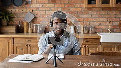 African American male vlogger record video on cellphone Stock Photo