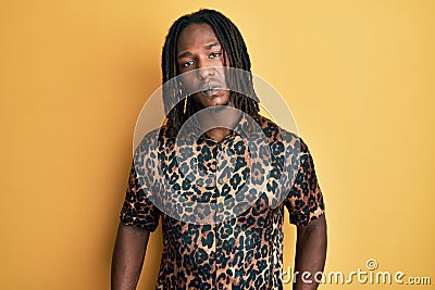 African american man with braids wearing leopard animal print shirt depressed and worry for distress, crying angry and afraid Stock Photo