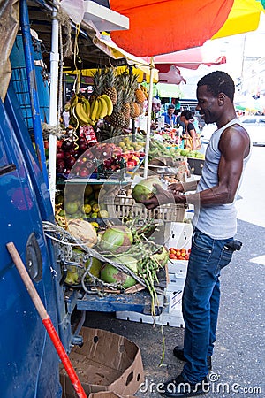 African American man buys coconuts Editorial Stock Photo
