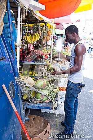 African American man buys coconuts Editorial Stock Photo