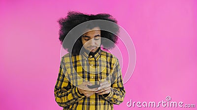 African American Man With Curly Hair Is Thinking Before Send Message On Purple Background Concept Of Emotions