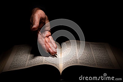 African American Man Hands Showing to the Bible, the Word of God Stock Photo