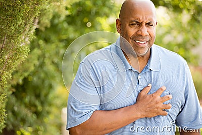 African American man having heart pains. Stock Photo