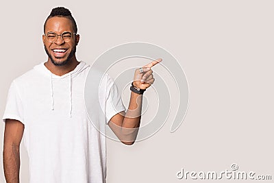 African American man show sale point at copy space aside Stock Photo
