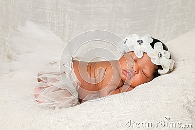 African American Newborn Asleep Ivory Headband Tutu Stock Photo