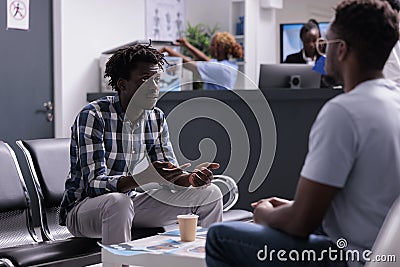 African american patients waiting in lobby Stock Photo
