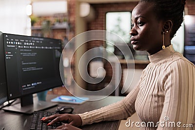 African american programmer typing big data code on compute Stock Photo