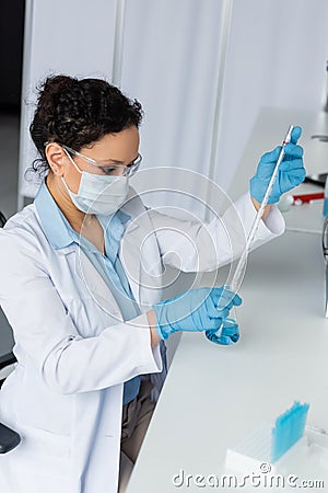 African american scientist in protective goggles Stock Photo