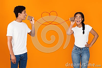 African-american student singing love song to his girlfriend Stock Photo