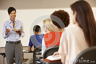 African American teacher teaching at front of class Stock Photo