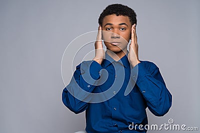 African American teenager in denim shirt calms Stock Photo