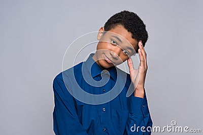 African American teenager in shirt is in turmoil. Stock Photo