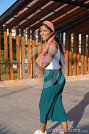 African American woman Cheerful walking in the park Stock Photo
