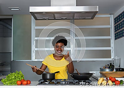 African american woman cooking at kitchen Stock Photo