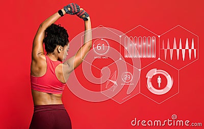 African american woman goes in for sports. Smartwatch shows her body parameters Stock Photo