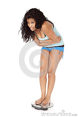 African American woman scales unsure Stock Photo